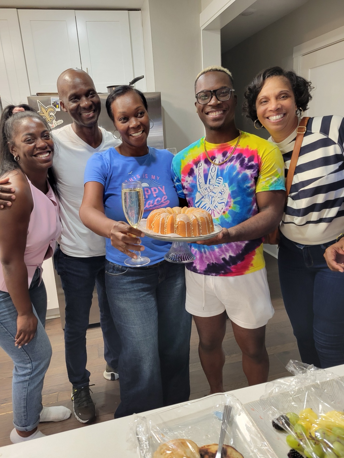 Danny P holding a cake